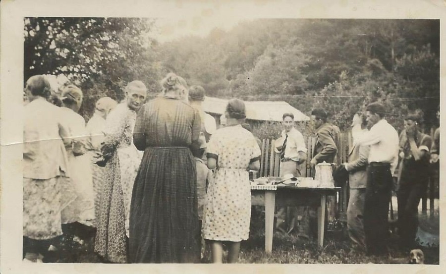 early twentieth century family dinner outside in the the mounatins